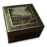 AN EARLY 20TH CENTURY PAPIER-M CHÈ SQUARE TRINKET BOX AND COVER Centrally painted with rustic