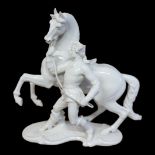 NYMPHENBURG, AN EARLY 20TH CENTURY BLANC DE CHINE PORCELAIN FIGURE OF AN EQUESTRIAN HORSE RIDER