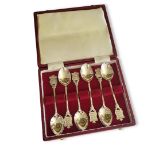 A BOX OF SILVER COMMEMORATIVE TEASPOONS Marked ‘Guernesey’ with the three lions emblem, hallmarked