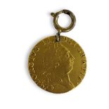 A KING GEORGE II 22CT GOLD SPADE GUINEA COIN, DATED 1790 Having a portrait and shield design to