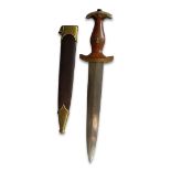 A GERMAN THIRD REICH WWII S.A. DAGGER Having a brown carved handle with swastika and eagle emblem,