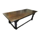 A 17TH CENTURY STYLE SOLID OAK REFECTORY TABLE The five plank top raised on four heavy turned and