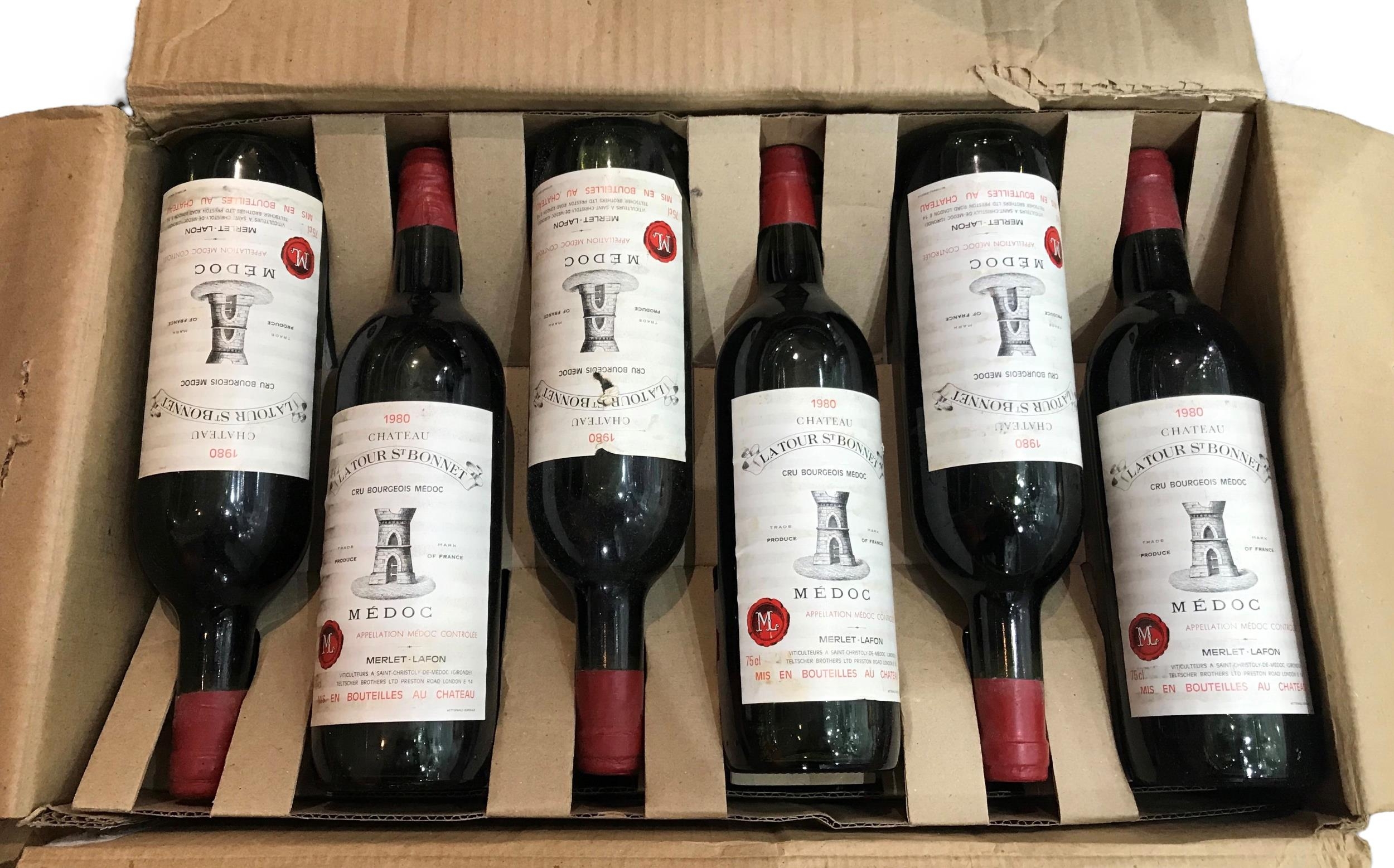 TWELVE BOTTLES OF VINTAGE CH TEAU TOUR ST. BONNET MEDOC, FRANCE, 1980 In original cardboard dispatch