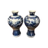 A PAIR OF LATE 19TH EARLY 20TH CENTURY CHINESE MEIPING BLUE AND WHITE VASES Decorated with a partial