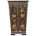 A DECORATIVE 19TH CENTURY CHINOISERIE PAINTED LINEN CABINET The panel doors opening to reveal
