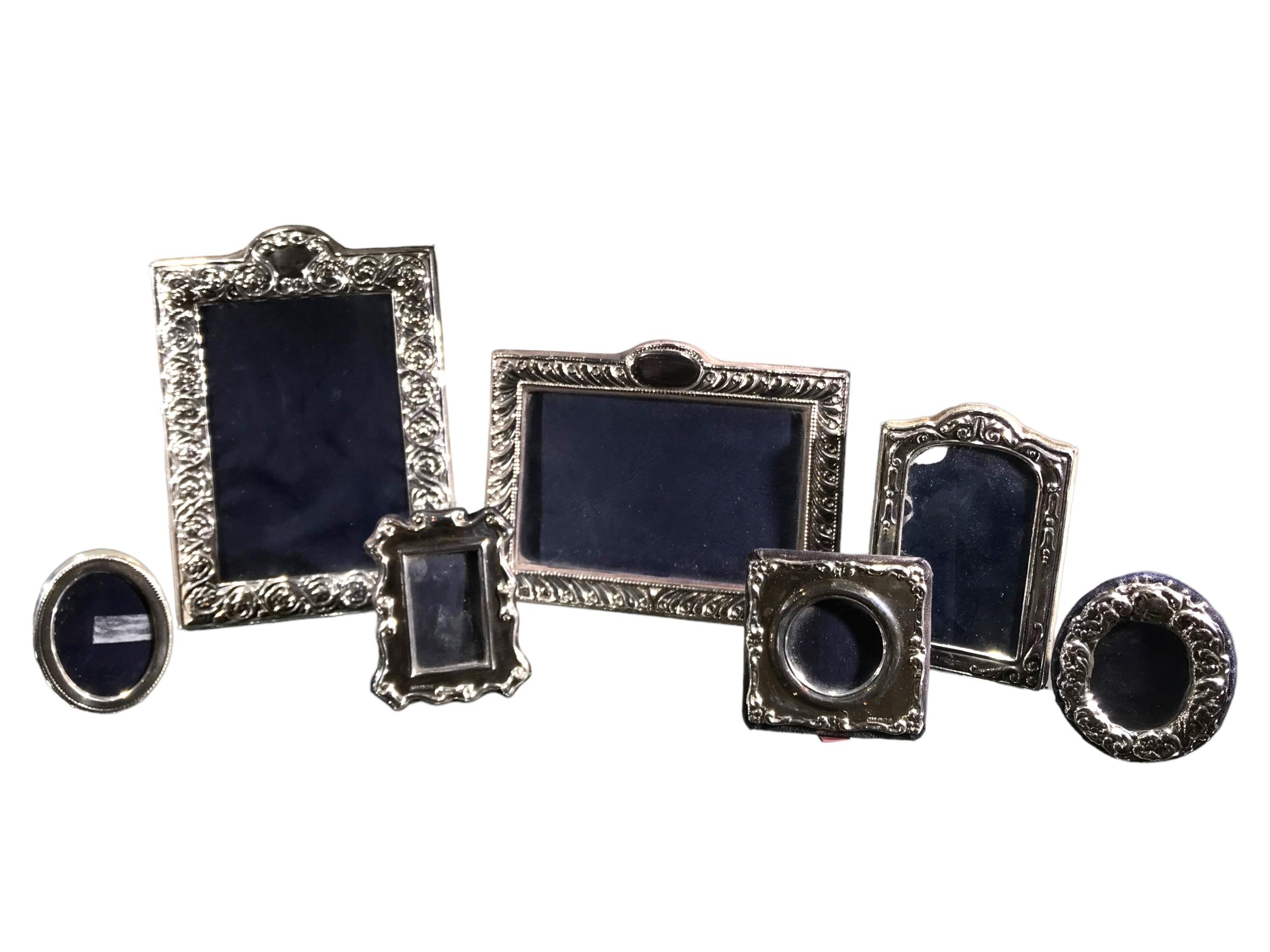 A COLLECTION OF SEVEN LATE 20TH CENTURY SILVER PHOTO FRAMES Hallmarked RBB, London & Sheffield, with