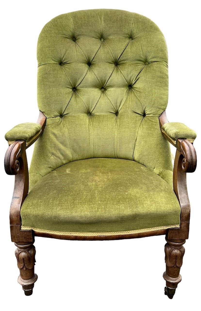 A 19TH CENTURY WILLIAM IV MAHOGANY UPHOLSTERED OPEN ARMCHAIR The button back above scrolling arms,