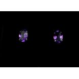A PAIR 18CT WHITE GOLD AMETHYST STUDS. (Approx Amethyst 0.80ct)