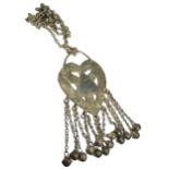 A 19TH CENTURY OMANI SILVER HEART SHAPED HALKA/HALQA ATTACHED TO SILVER CHAIN Having chased