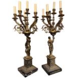 A PAIR OF NEOCLASSICAL DESIGN GILT METAL FIGURAL FIVE BRANCH CANDELABRA LAMPS Terminating on