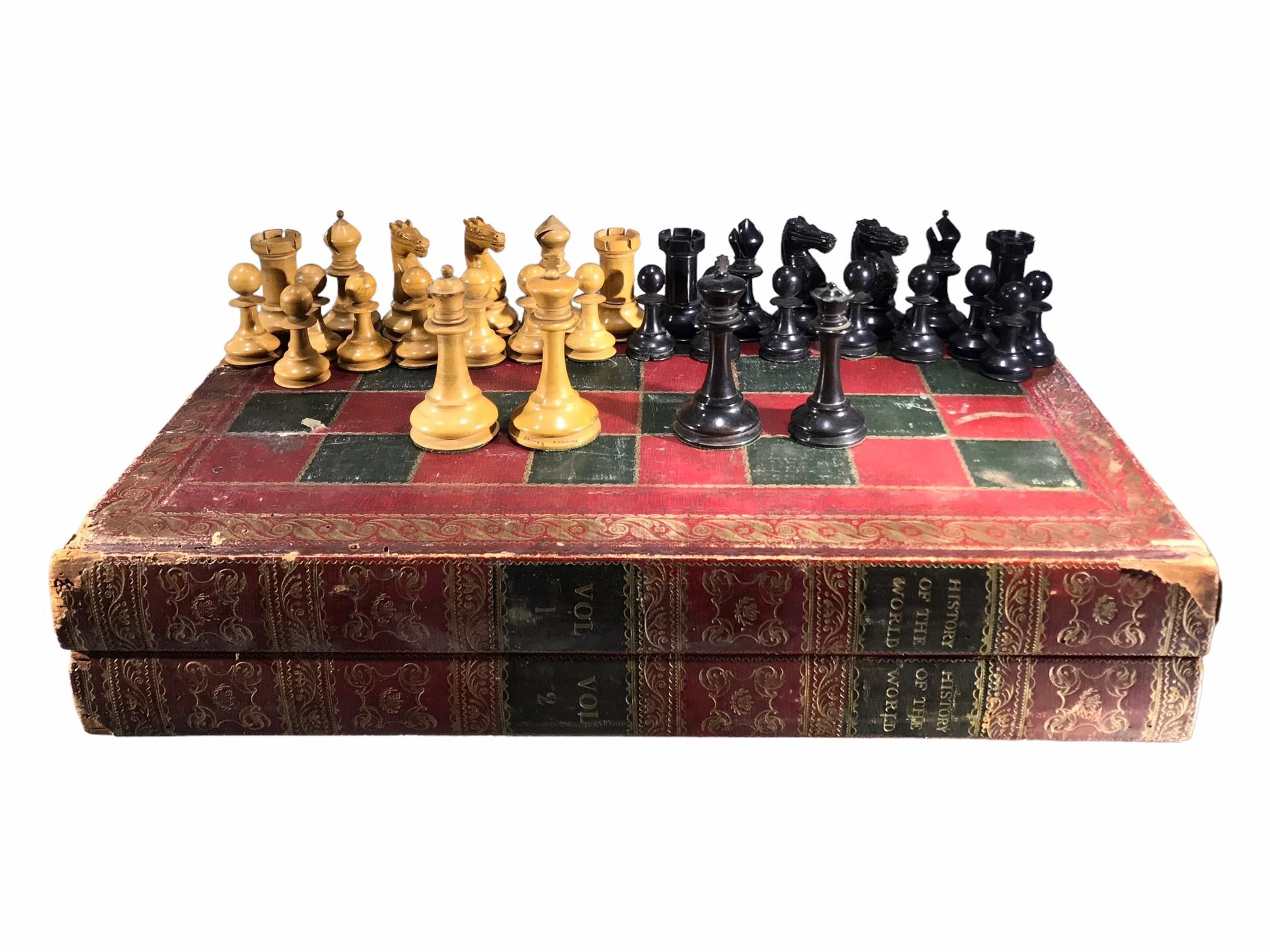 JAQUES OF LONDON, AN EARLY 20TH CENTURY CARVED WOODEN CHESS SET Housed in a novelty book chess