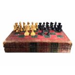 JAQUES OF LONDON, AN EARLY 20TH CENTURY CARVED WOODEN CHESS SET Housed in a novelty book chess