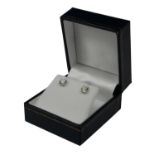 A PAIR OF 18CT WHITE GOLD FOUR CLAW ROUND BRILLIANT CUT DIAMOND SOLITAIRE EARRINGS. (Diamonds approx