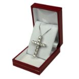 A 9CT WHITE GOLD, ROUND BRILLIANT CUT DIAMOND SET CROSS on a silver chain. (Approx Diamonds 2.41ct)