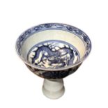 A LATE 19TH EARLY 20TH CENTURY CHINESE BLUE AND WHITE STEM CUP Decorated interior showing a dragon