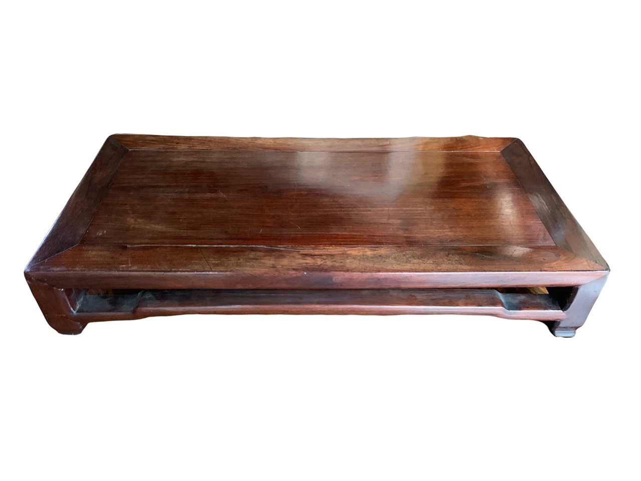 A 19TH CENTURY CHINESE HARDWOOD KANG TABLE The single panel top set within a rectangular frame above