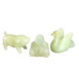 THREE CHINESE CELADON JADE CARVED FIGURES, SWAN, PIG AND BUDDHA. (largest h 3.5cm x w 5.4cm x