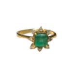 A YELLOW METAL, EMERALD AND DIAMOND RING. Having central square cut emerald surmounted with eight