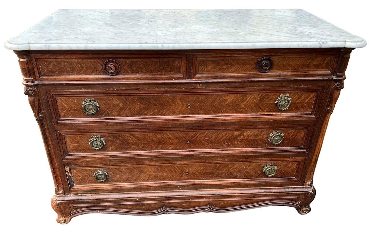 A 19TH CENTURY FRENCH HERRINGBONE ROSEWOOD COMMODE The marble top above two short and four long