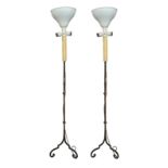A PAIR OF 16TH CENTURY DESIGN WROUGHT IRON CANDLE STAND LAMPS Raised on triform scrolling