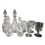 A COLLECTION OF GEORGIAN AND LATER GLASS DECANTERS TOGETHER WITH FOUR LARGE WINE GLASSES Two