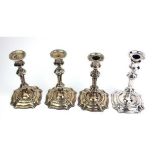 A SET OF FOUR VICTORIAN SILVER CANDLESTICKS Georgian knopped design, having circular sconces and