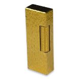 A GOLD PLATED DUNHILL ROLLAGAS LIGHTER HAVING TEXTURED BARK FINISH. (h 6.5cm x w 2.5cm x depth 1.