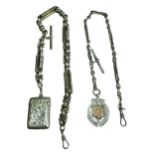 AN EDWARDIAN SILVER VESTA CASE, HALLMARKED BIRMINGHAM, 1904 Attached to a large Albert chain,