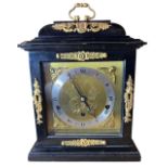 F.W. ELLIOT, AN EIGHT DAY EBONISED CHIMING BRACKET CLOCK With gilt metal mounted movement, signed ‘