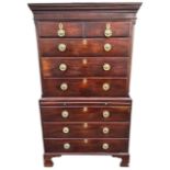 A GEORGE III MAHOGANY CHEST ON CHEST Of two short over six long graduated drawers and brushing