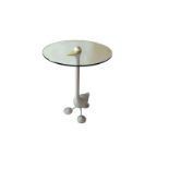 ALESSANDRO MENDINI, A CAST ALUMINIUM OCCASIONAL TABLE FORMED AS A DUCK With circular glass top,