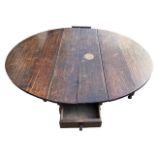 A LARGE 18TH CENTURY OAK OVAL GATELEG TABLE With two large drawers raised on eight turned baluster