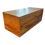 A COLONIAL HARDWOOD BLANKET BOX With hinged lid. (h 41cm x d 48cm x w 109.5cm)