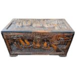 A CHINESE CARVED CAMPHOR WOOD TRUNK Decorated with Chinese ships and pagoda buildings. (h 56.5cm x d