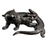 彗光作, A JAPANESE BRONZE OF A BEAR FIGHTING A CROCODILE. (h 12.5cm x w 26cm x d 18cm)