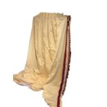 A LARGE PAIR OF YELLOW CURTAINS With red and gold tassel, double lined. (drop 270cm x w top110cm x