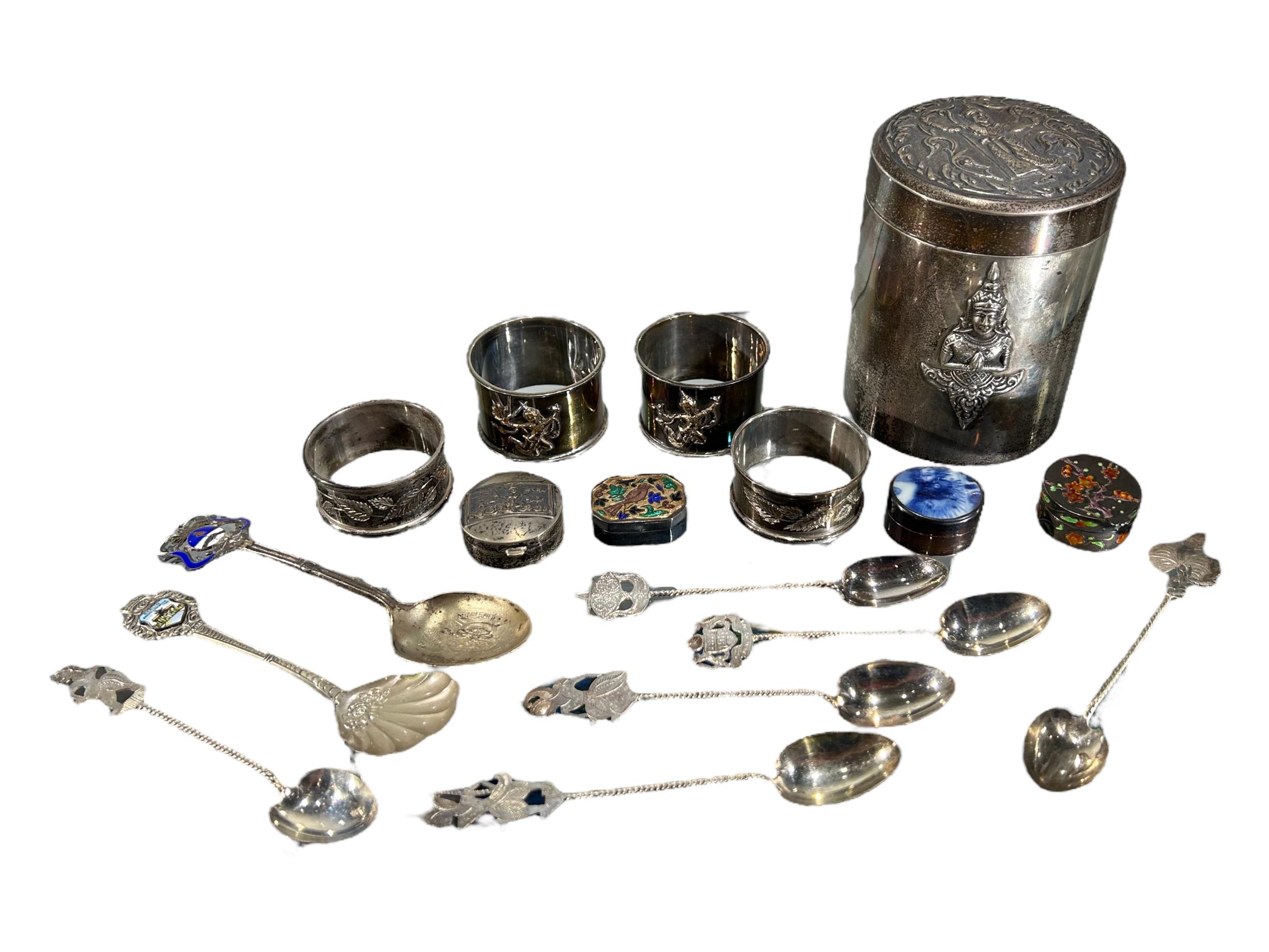 A SIAM STERLING SILVER CANISTER, TOGETHER WITH A COLLECTION OF SILVER NAPKIN RINGS, SPOONS AND