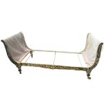 A 19TH CRONENTURY FRENCH PAINTED CAST IRON DAYBED, Decorated with with scrolling foliage.