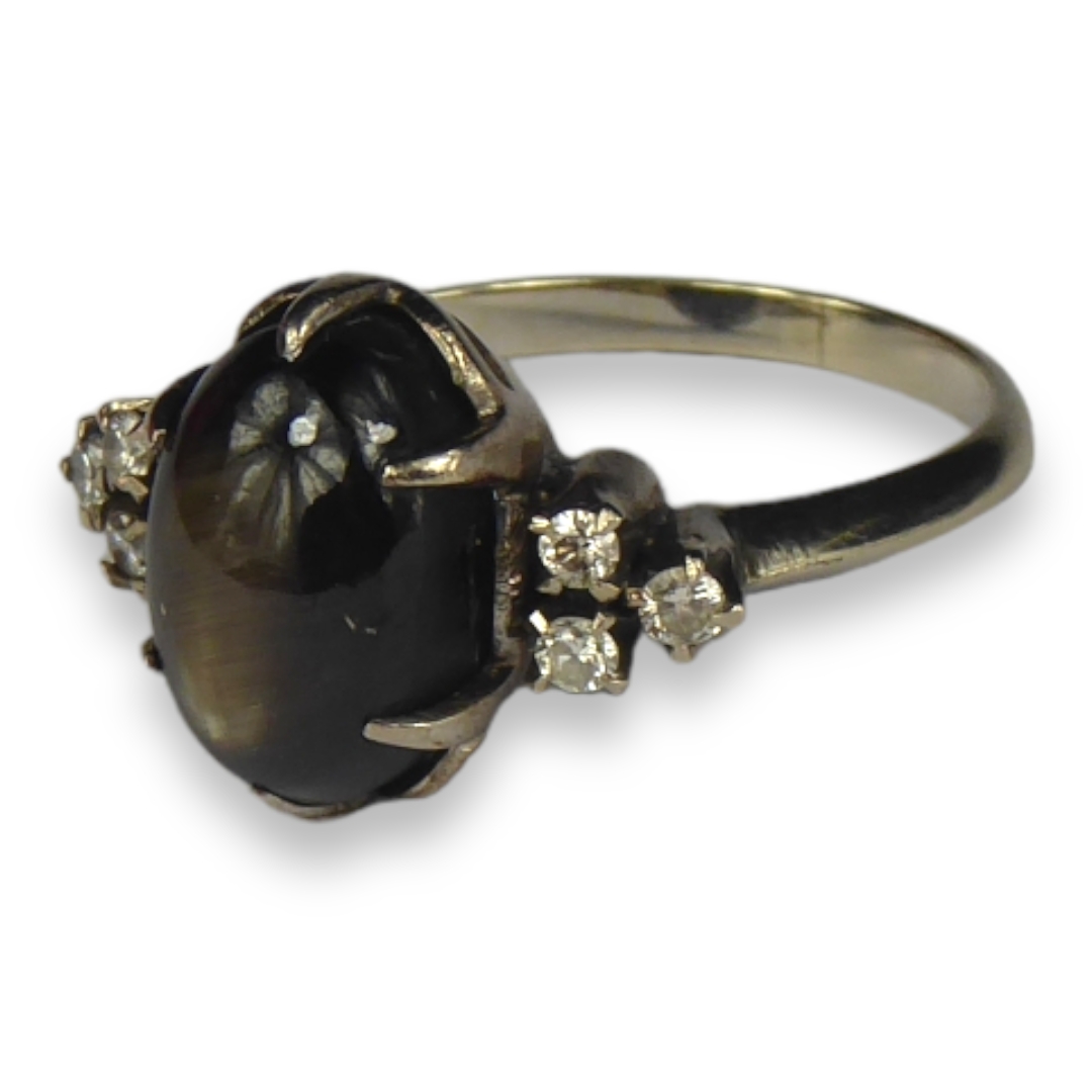 A 14CT WHITE GOLD, BLACK STAR SAPPHIRE AND DIAMOND RING The central cabochon black star sapphire - Image 2 of 3