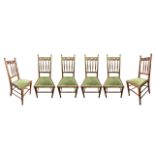 A SET OF SIX LATE 19TH CENTURY (POSSIBLY SCOTTISH) ARTS & CRAFTS OAK DINING CHAIRS With pierced