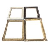 A COLLECTION OF FOUR 19TH CENTURY GILT GESSO AND PAINTED FRAMES. (largest 56cm x 71cm)