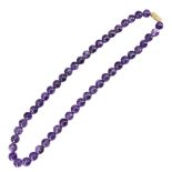 A VINTAGE AMETHYST BEADED NECKLACE. (length 44cm)