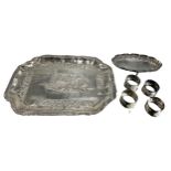 AN INDIAN WHITE METAL CHASED & REPOUSSÉ TRAY (TESTED AS STERLING SILVER), TOGETHER WITH A INDIAN