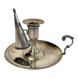 A GEORGIAN SILVER CHAMBERSTICK Having a beaded edge and detachable conical snuffer, engraved with
