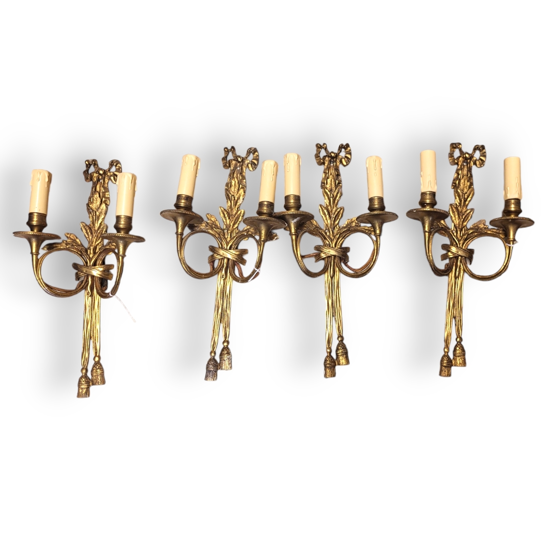 AN EARLY 20TH CENTURY SET OF FOUR LOUIS XVI STYLE PATINATED BRONZE AND ORMOLU TWO BRANCH WALL