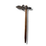 AN ANTIQUE NATIVE AMERICAN INDIAN IRON AND WOOD TOMAHAWK/PEACE PIPE Having a fleur-de-lis form axe
