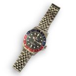 ROLEX, GMT MASTER, A VINTAGE STAINLESS STEEL GENT’S WRISTWATCH Having a red and blue 'Pepsi'