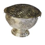A LARGE VICTORIAN SILVER PEDESTAL BOWL Having a scalloped edge and embossed floral decoration,