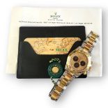 ROLEX, DAYTONA COSMOGRAPH, A STAINLESS STEEL AND YELLOW GOLD GENT’S WRISTWATCH Having a Paul