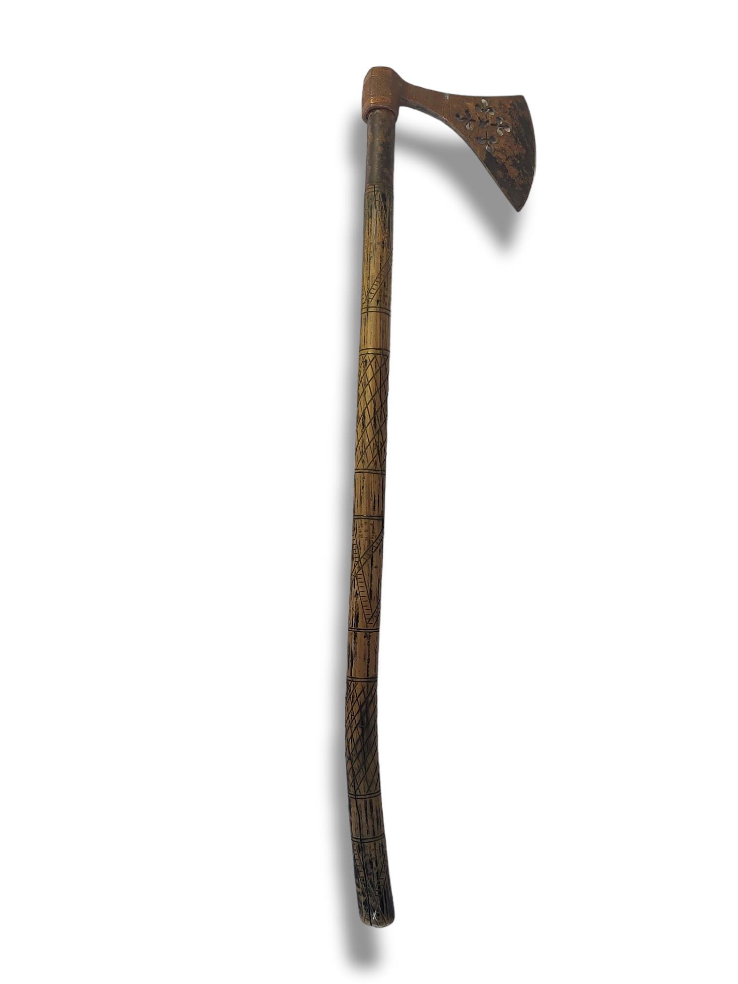 AN ANTIQUE NATIVE AMERICAN INDIAN IRON AND WOOD TOMAHAWK Having a iron axe head with copper